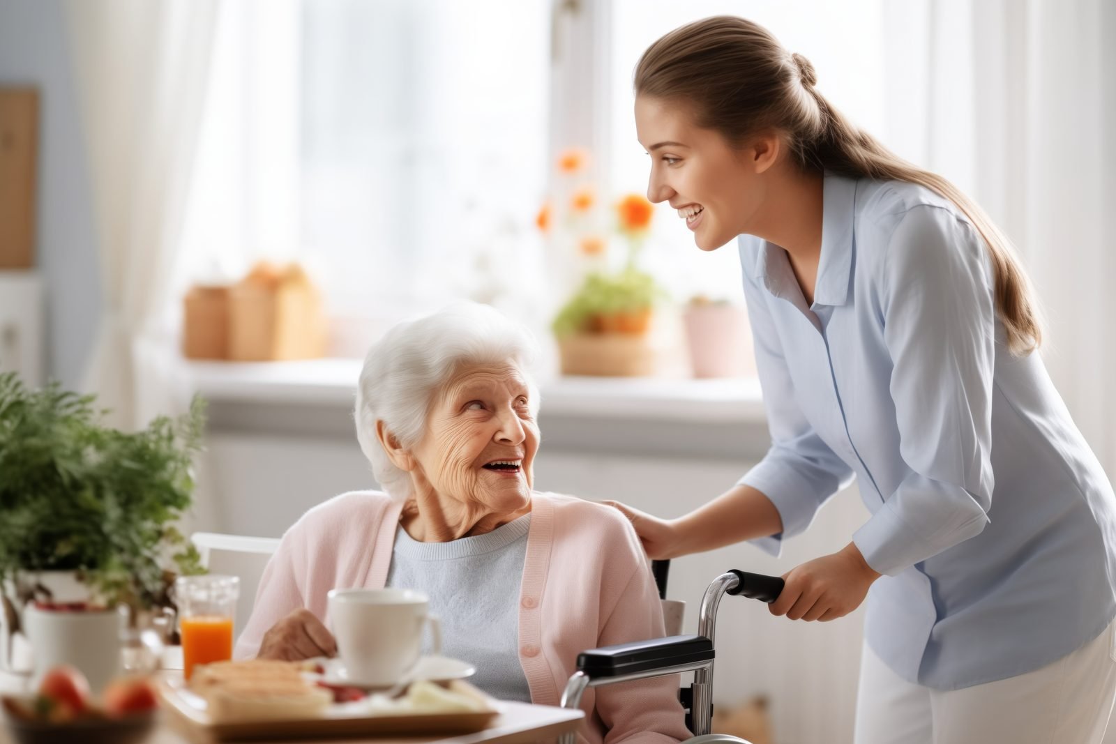 A Pluto BV care worker smiling with a client over breakfast at her kitchen table